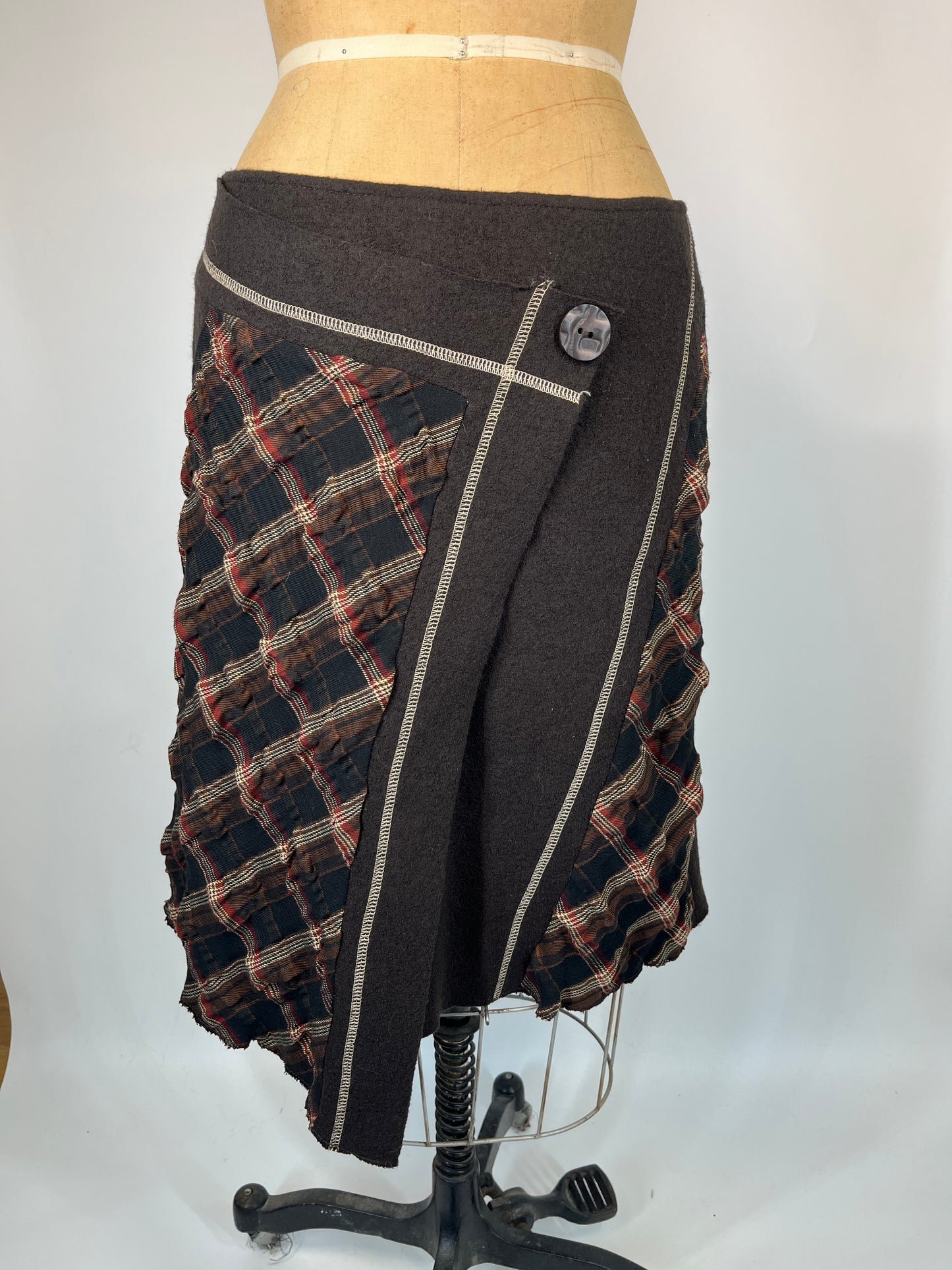 Paid Asymmetric Skirt With Contrast Stitching and Button Detail