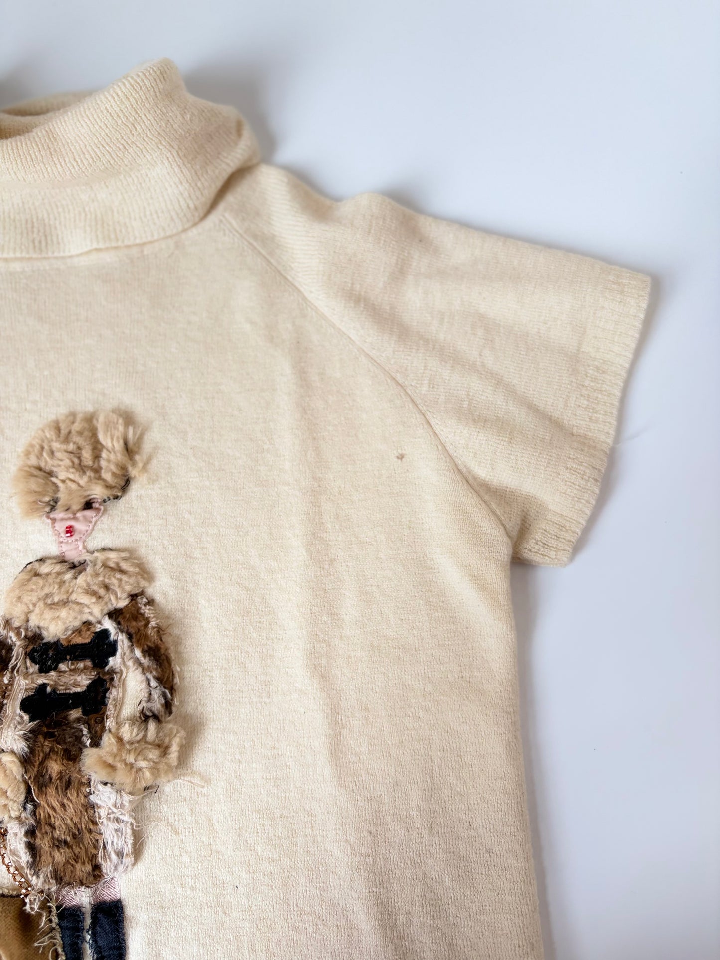 Mixed Media Sweater with Woman Carrying Purse